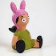 Halloween-Emporium Louise Belcher vinyl figure from Bob's Burgers with a pink bunny hat and green dress.