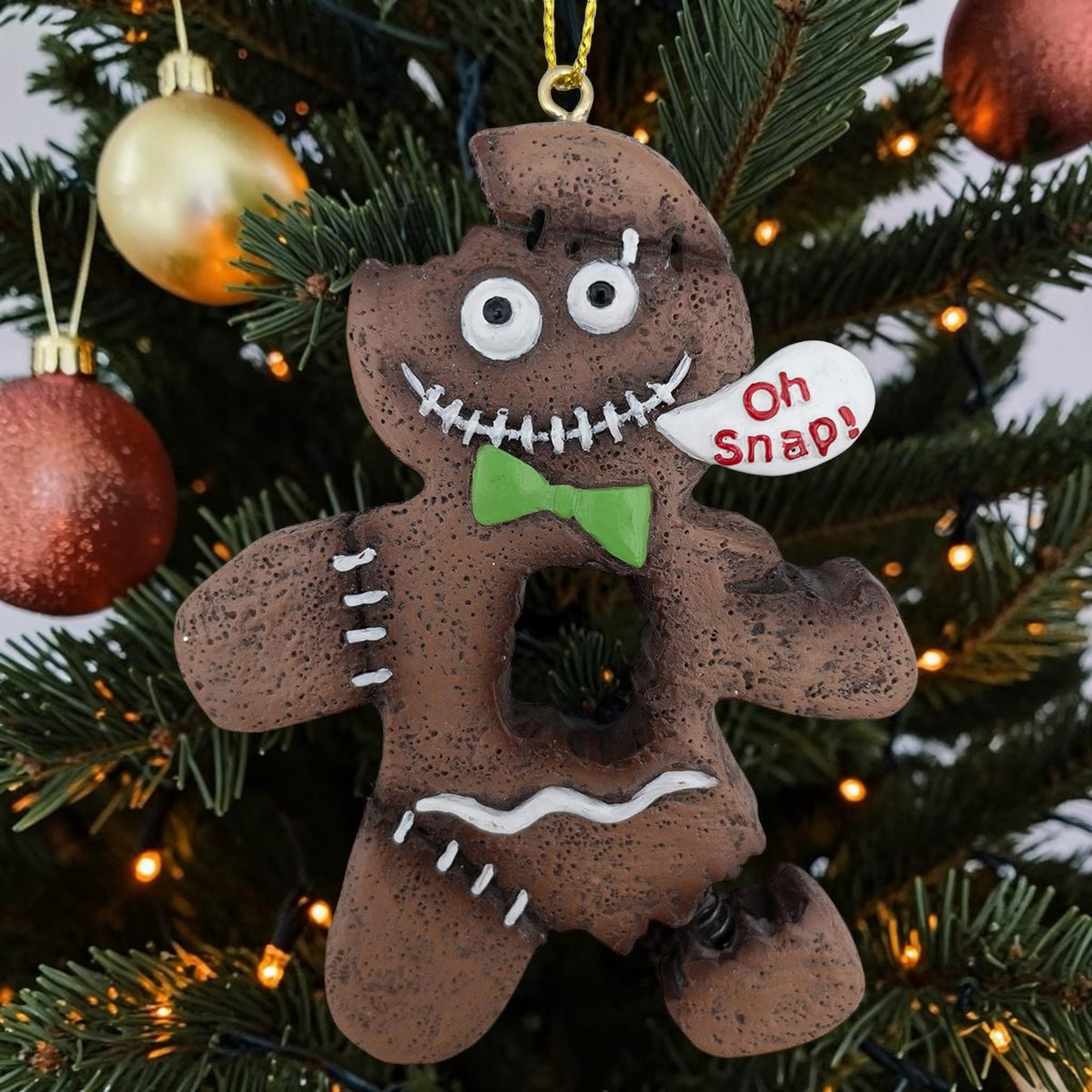 Halloween-Emporium spooky gingerbread man ornament with stitched details, green bow tie, and Oh Snap speech bubble.