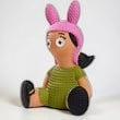 Halloween-Emporium Louise Belcher vinyl figure from Bobs Burgers with a pink bunny hat and green dress.